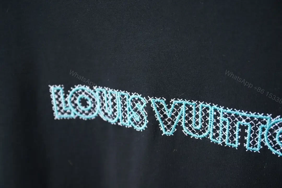 View 8 of Black Cotton Tee with Teal Embroidered Logo Accent, Minimalist Style, Everyday Luxury Tee