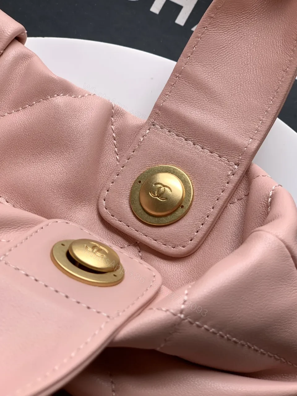 View 3 of Soft Pink Quilted Handbag with Gold Accents, Compact Luxury Tote