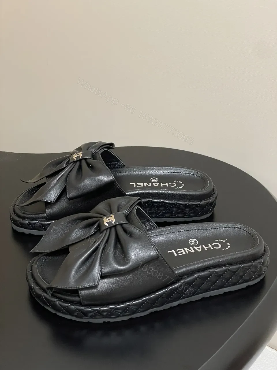 View 9 of Chic Black Quilted Slides with Bow Detail - Luxury Casual Platform