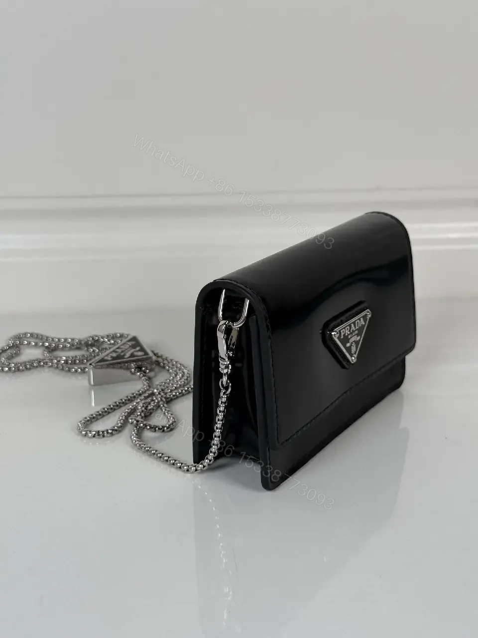 View 10 of Chic Black Leather Mini Bag with Signature Logo Chain