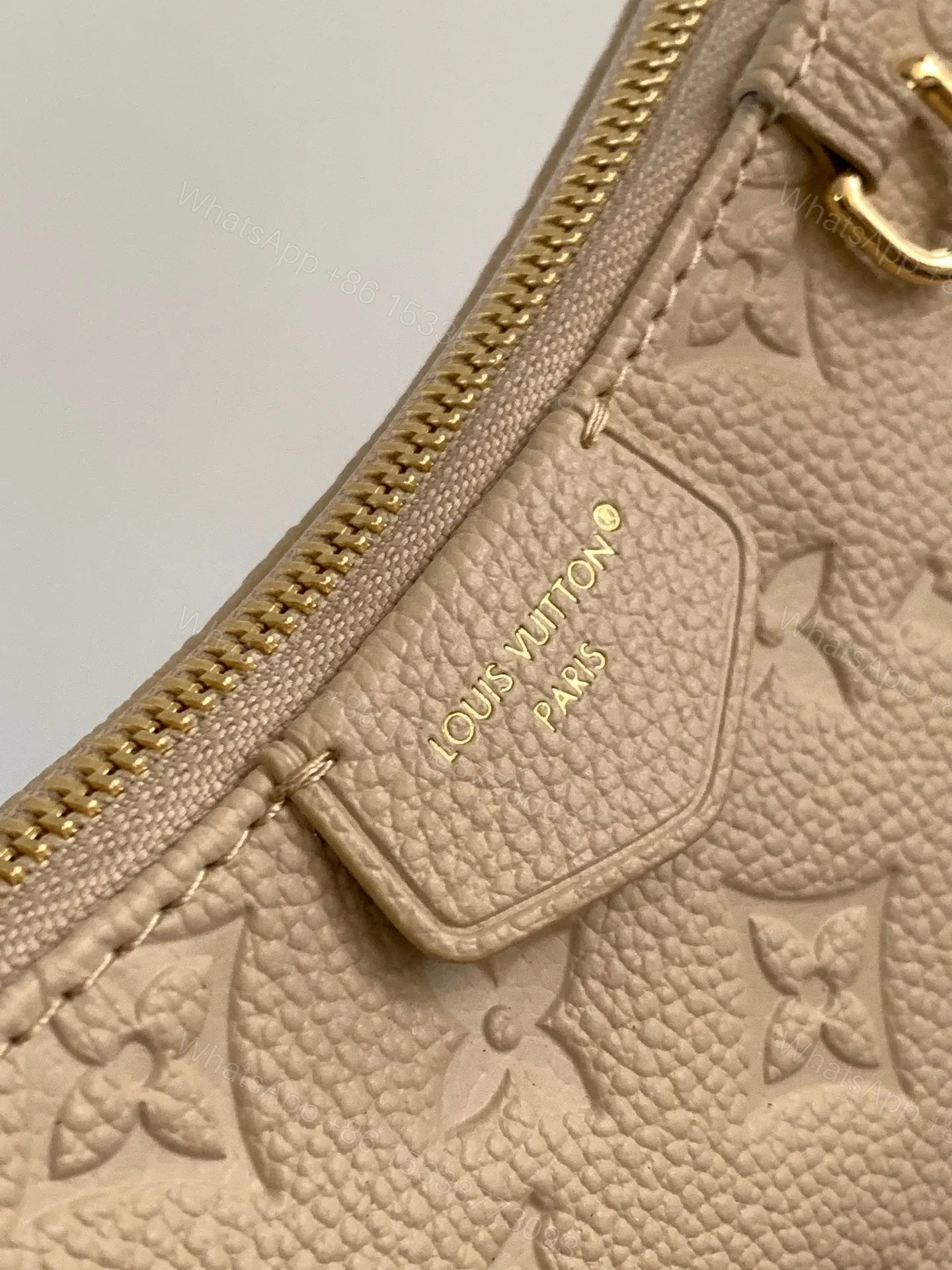 View 7 of LV EASY POUCH ON STRAP 19 IN BEIGE MONOGRAM EMPREINTE LEATHER