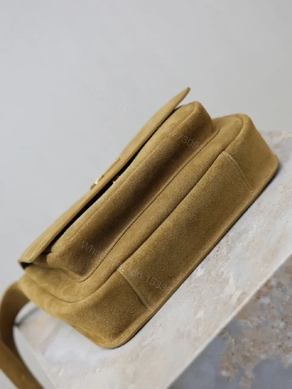 View 9 of Timeless Suede Crossbody with Gold Emblem, Compact Luxury