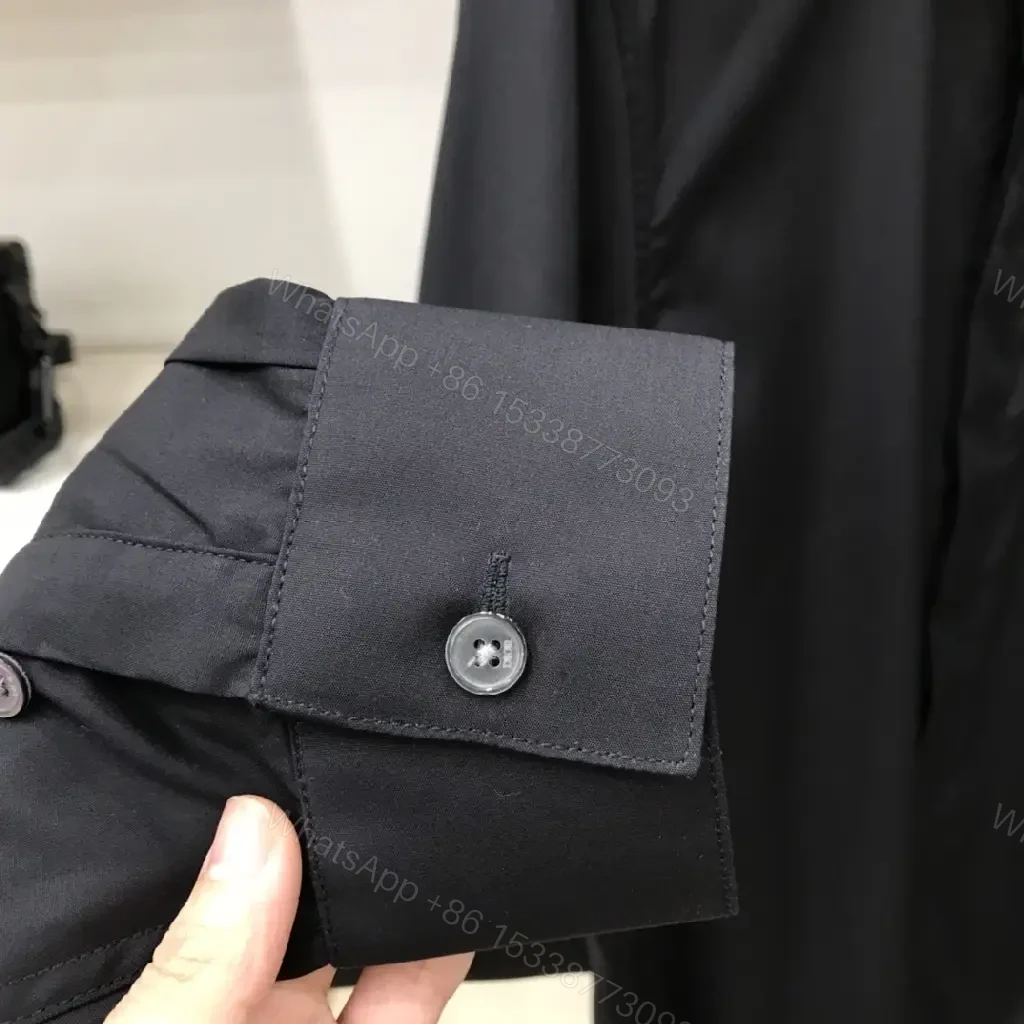 View 2 of Minimal Black Shirt Jacket with Subtle Logo Button Front