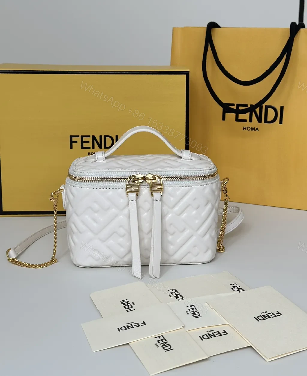 Quilted White Satchel: Gold-Accent Compact Luxury Bag — view 1