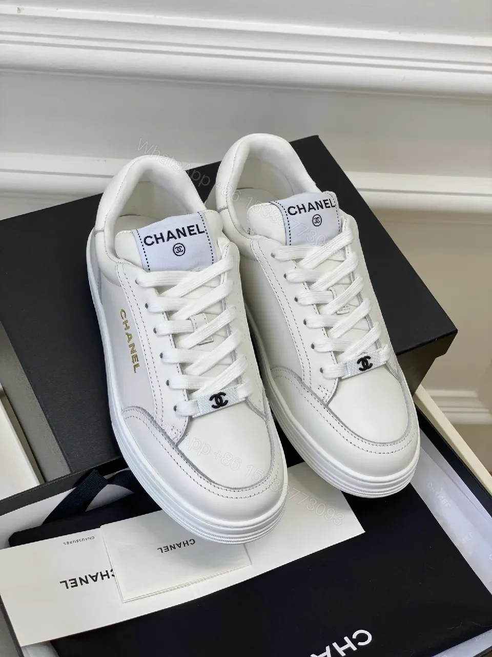 View 9 of White Leather Sneakers: Minimalist High-Tops with Gold Logo