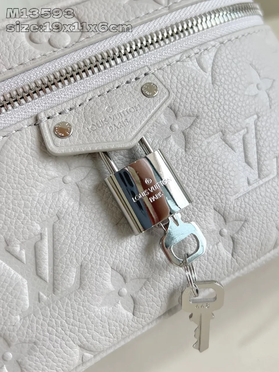 View 4 of Soft White Leather Compact Day-to-Night Bag with Textured Pattern