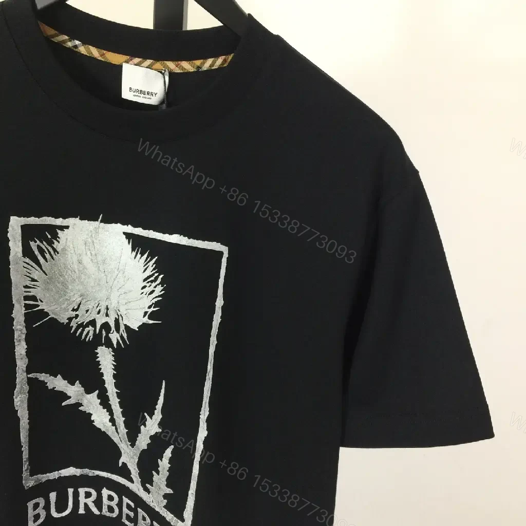 View 2 of Minimalist Black Cotton Tee with Graphic Burberry-Inspired Emblem