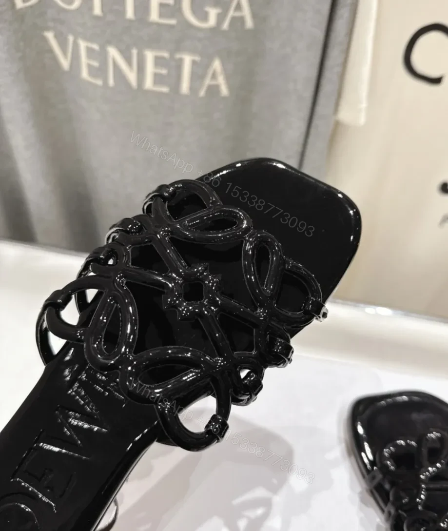 View 2 of Loewe Leather Petal Anagram Slides in Black
