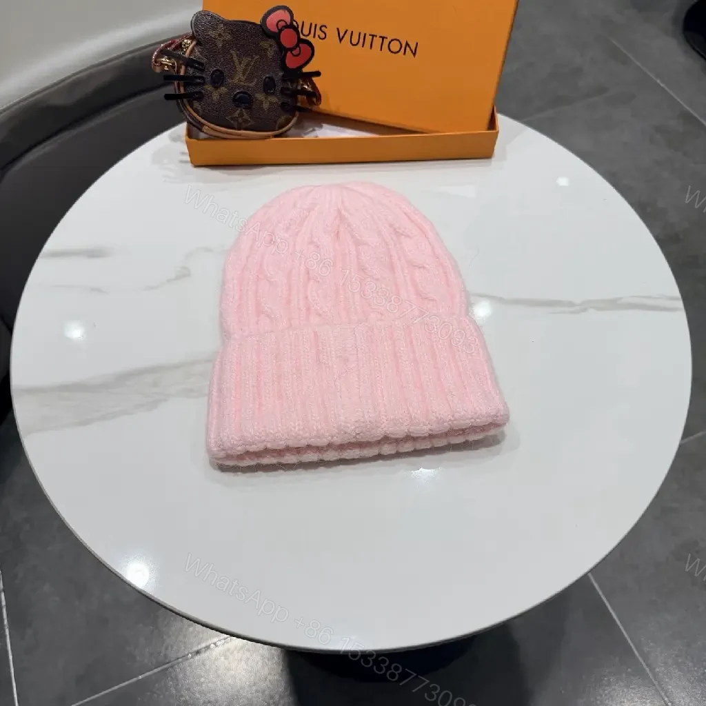 View 2 of Pastel Knit Beanie with Silver Emblem – Luxe Everyday Accessory