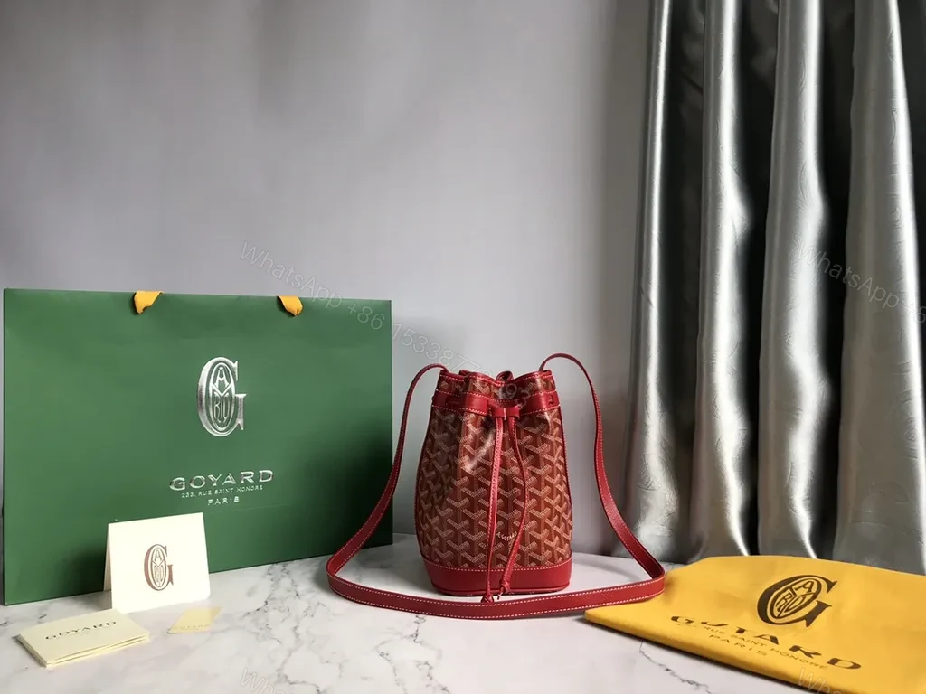View 2 of Bold Goyardine Bucket Bag in Red Leather Trim