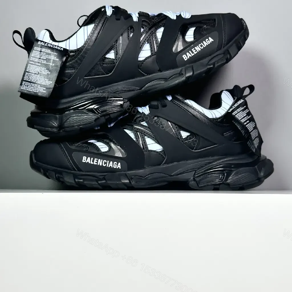 View 7 of black leather and mesh sneakers with logo motif for luxury streetwear