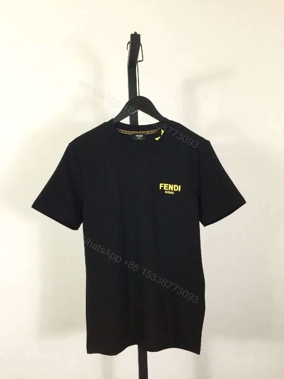 Black Cotton T-Shirt + Minimalist Logo + Modern Crew Neck + Subtle Luxe Detail + T-Shirt — view 1