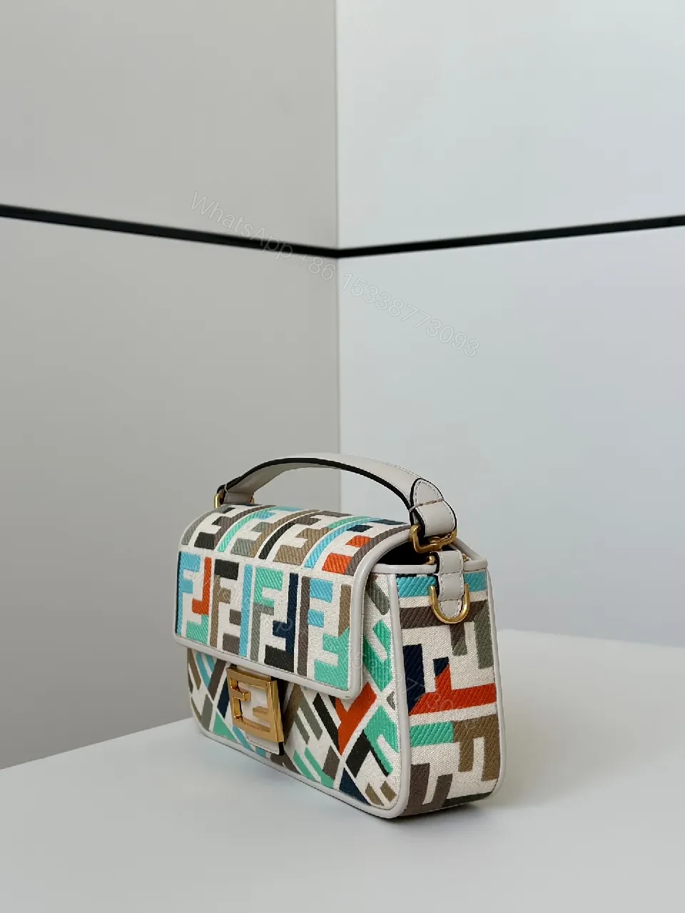 View 3 of Geometric Pattern Bag with Bold Gold Hardware Crossbody