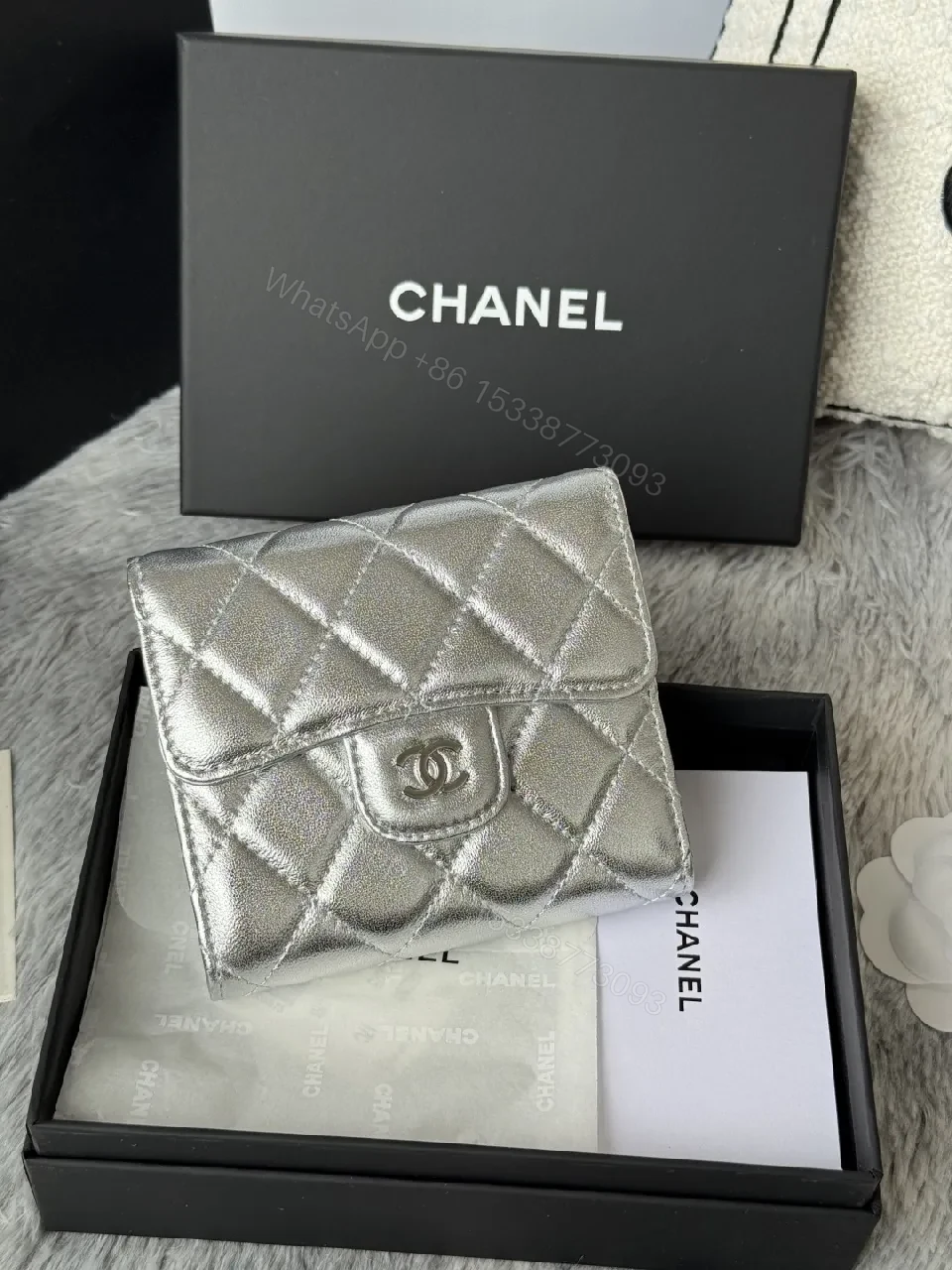 View 2 of Compact Silver Quilted Wallet with Signature Hardware