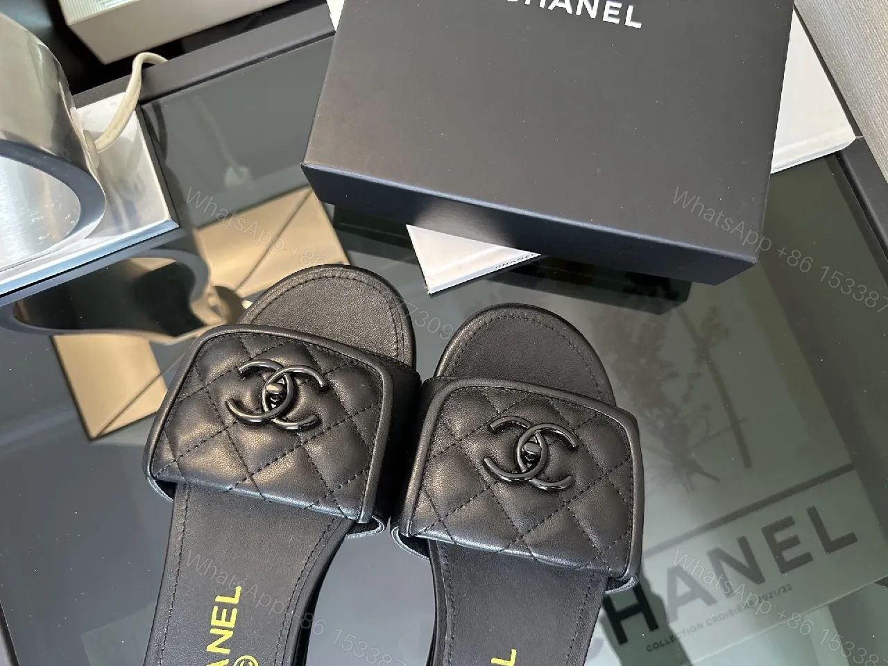 View 2 of Chic Black Quilted Slides with Logo Detailing