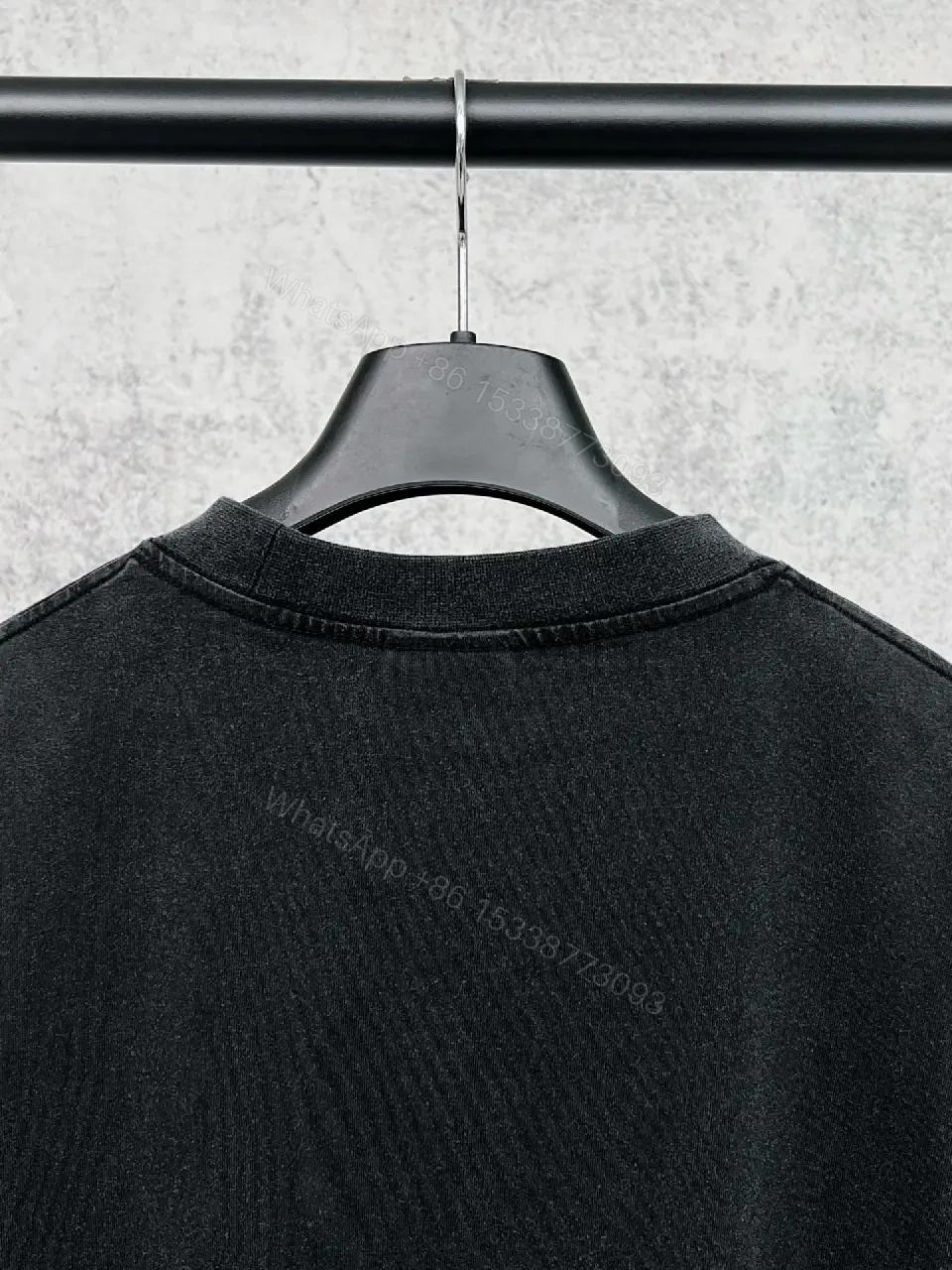 View 9 of Oversized Black Cotton Tee with Distressed Logo – Avant-Garde Streetwear