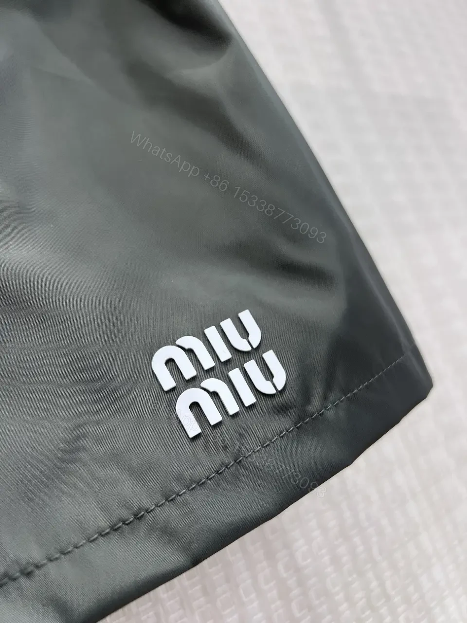 View 9 of Gray Nylon Mini Skirt Drawstring Waist Miu Miu Style Front Patch Pocket Skirt