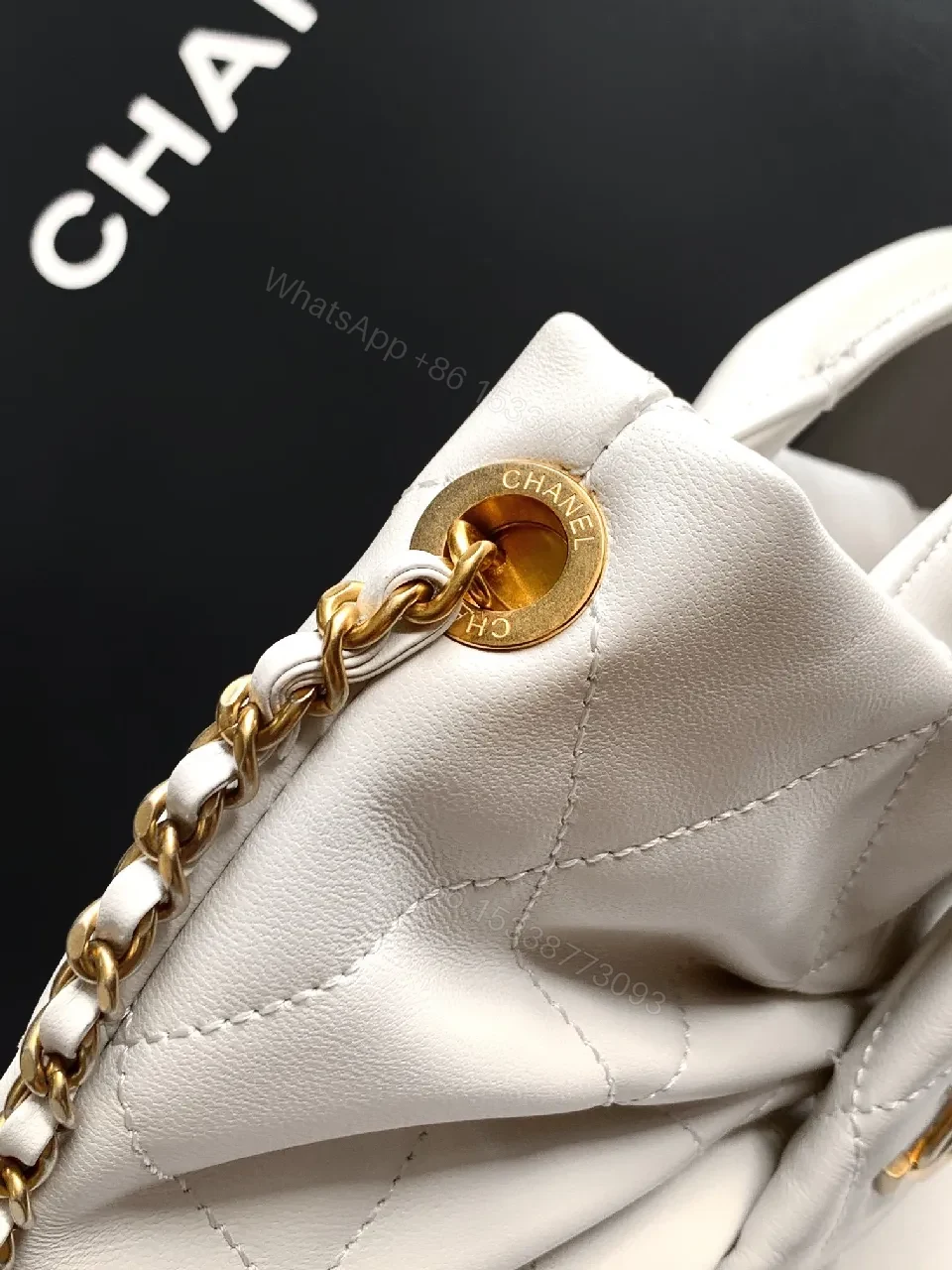 View 3 of Pearl White Quilted Satin Mini Bag with Bow Detail and Gold Logo