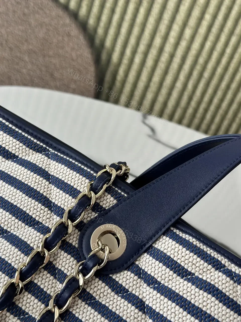 View 2 of Navy Stripe Woven Tote Bag with Leather Accents and Chanel Logo