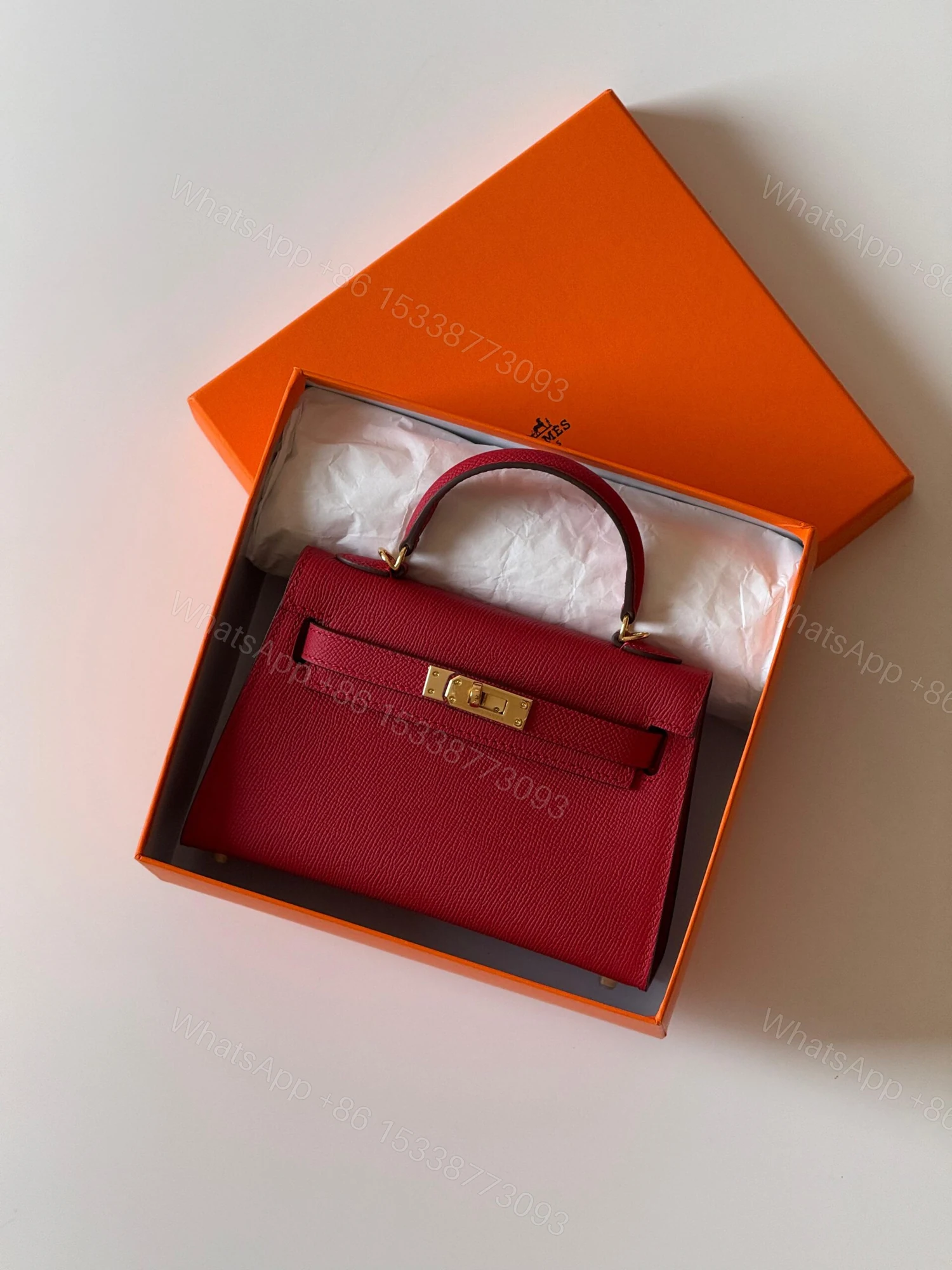 Hermès Mini Kelly 19 bag in Rouge Vif Courchevel Leather — view 1