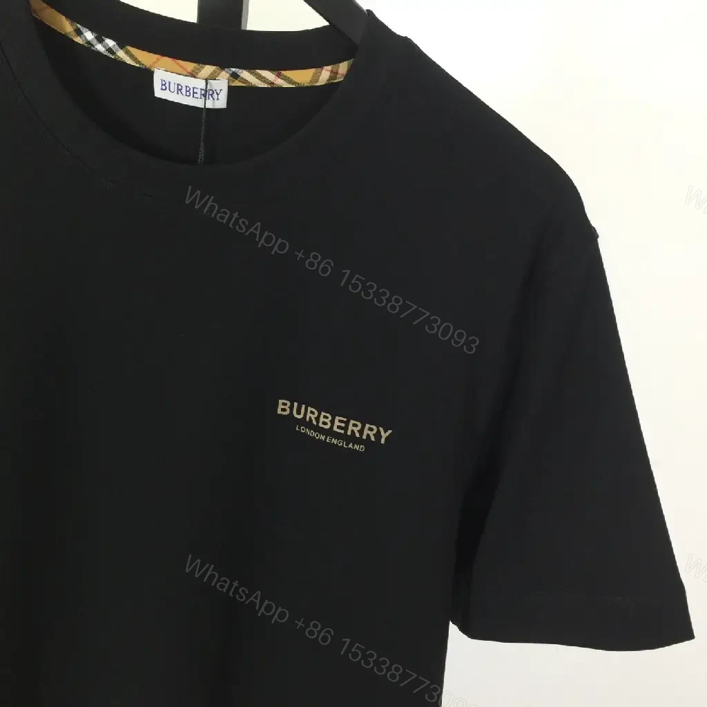 View 5 of Minimalist Black Cotton Tee, Subtle Logo, Everyday Comfort