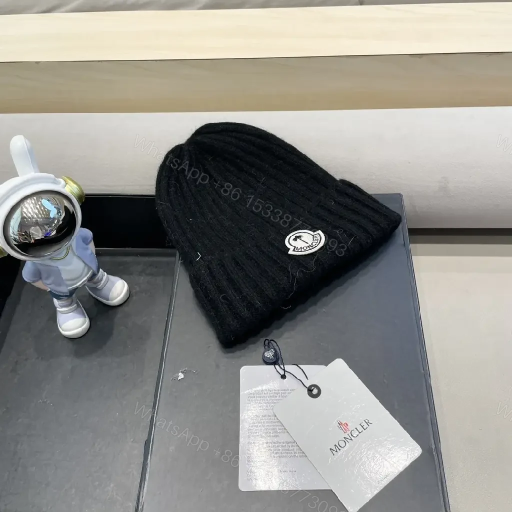 View 9 of Cozy Black Knit Beanie with Signature Patch, Luxury Style