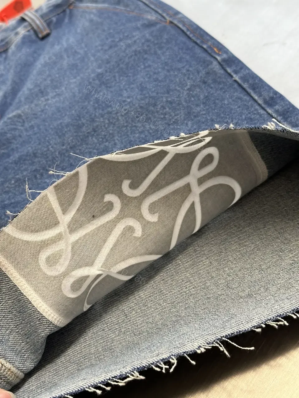 View 7 of Denim Shorts: White Embroidered Logo, Relaxed Fit, Luxe Style