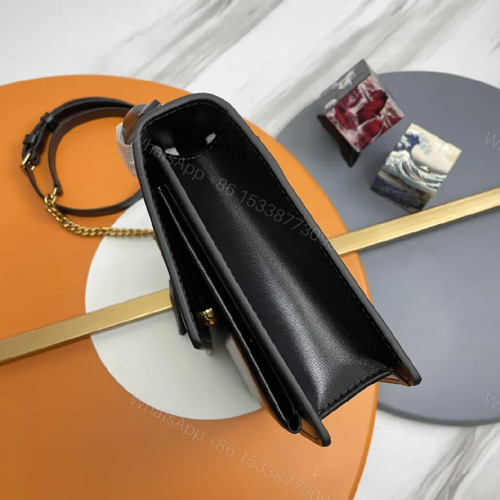 View 2 of Chic Black Leather Crossbody with Gold Emblem: Compact Luxury