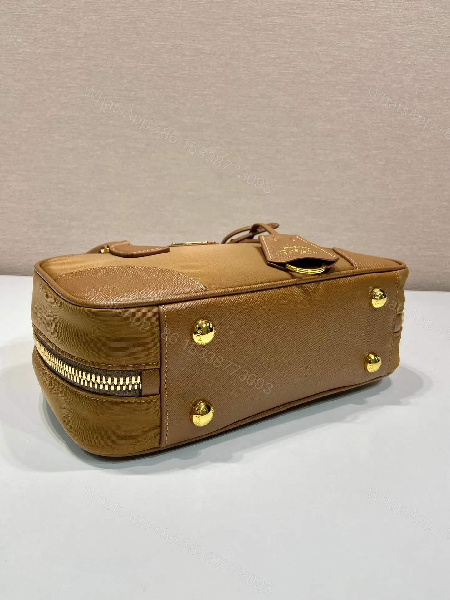 View 2 of SMALL TOP HANDLE BAG 25 IN GOLDEN BROWN NYLON AND CALFSKIN TRIM