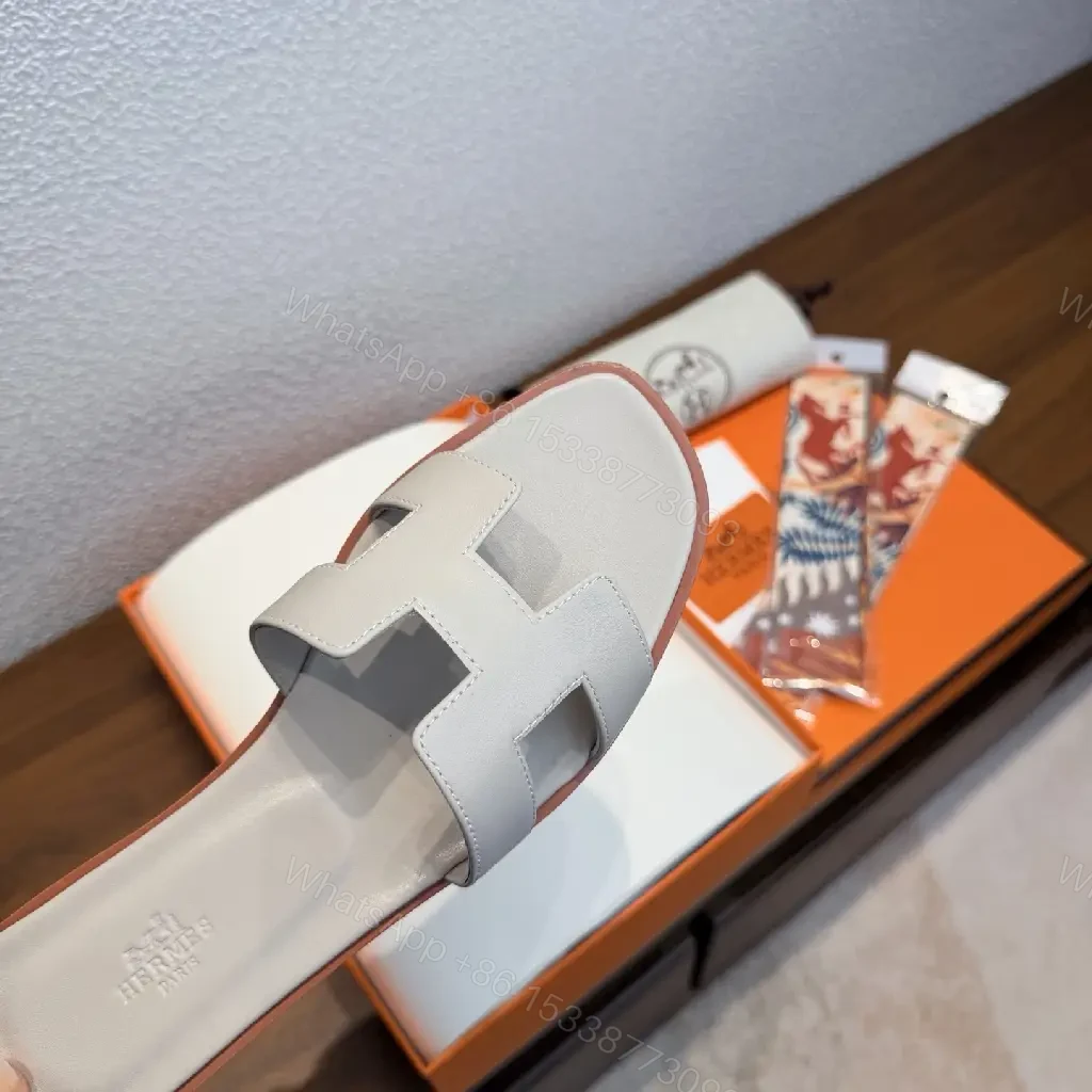 View 2 of White Leather Hermès Sandals with Cross Straps Slide Sandals Preview Set