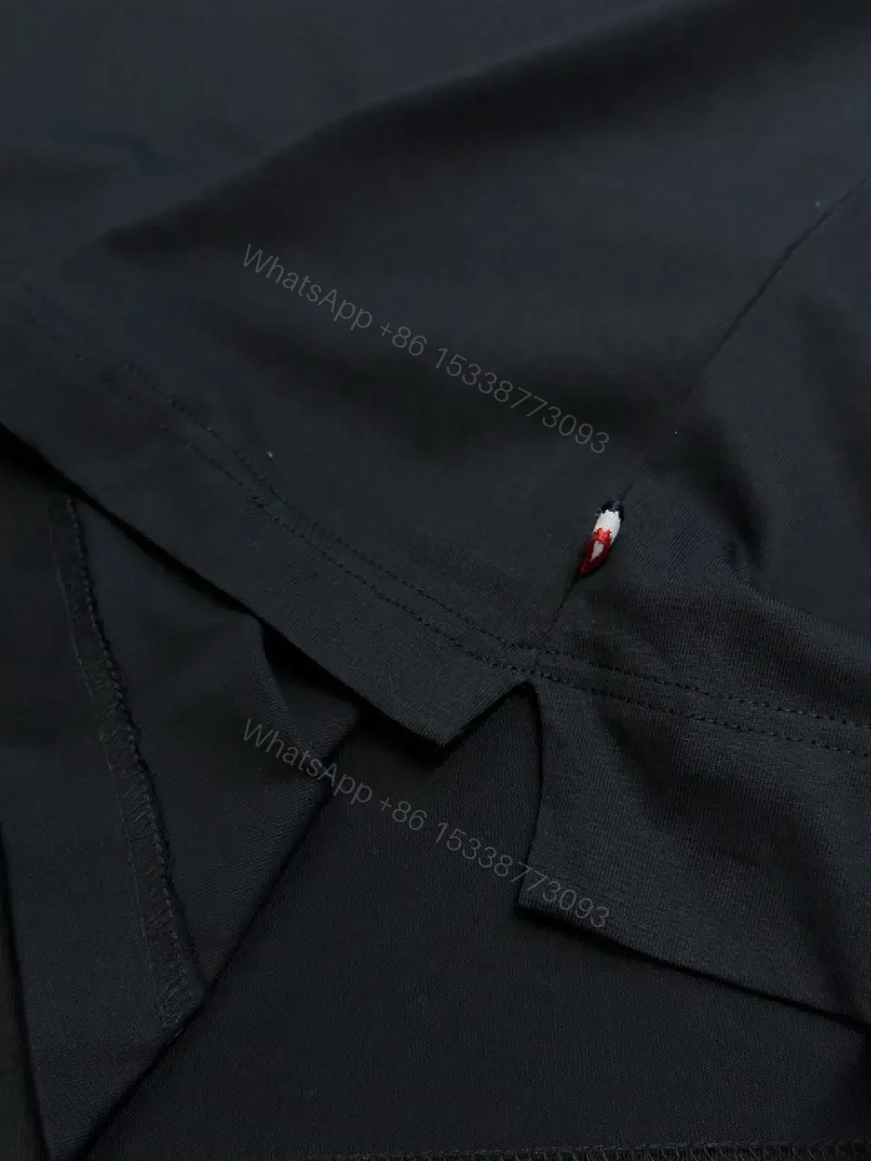 View 8 of Minimalist Black Tee with Logo Crest, Relaxed Fit, Premium Cotton