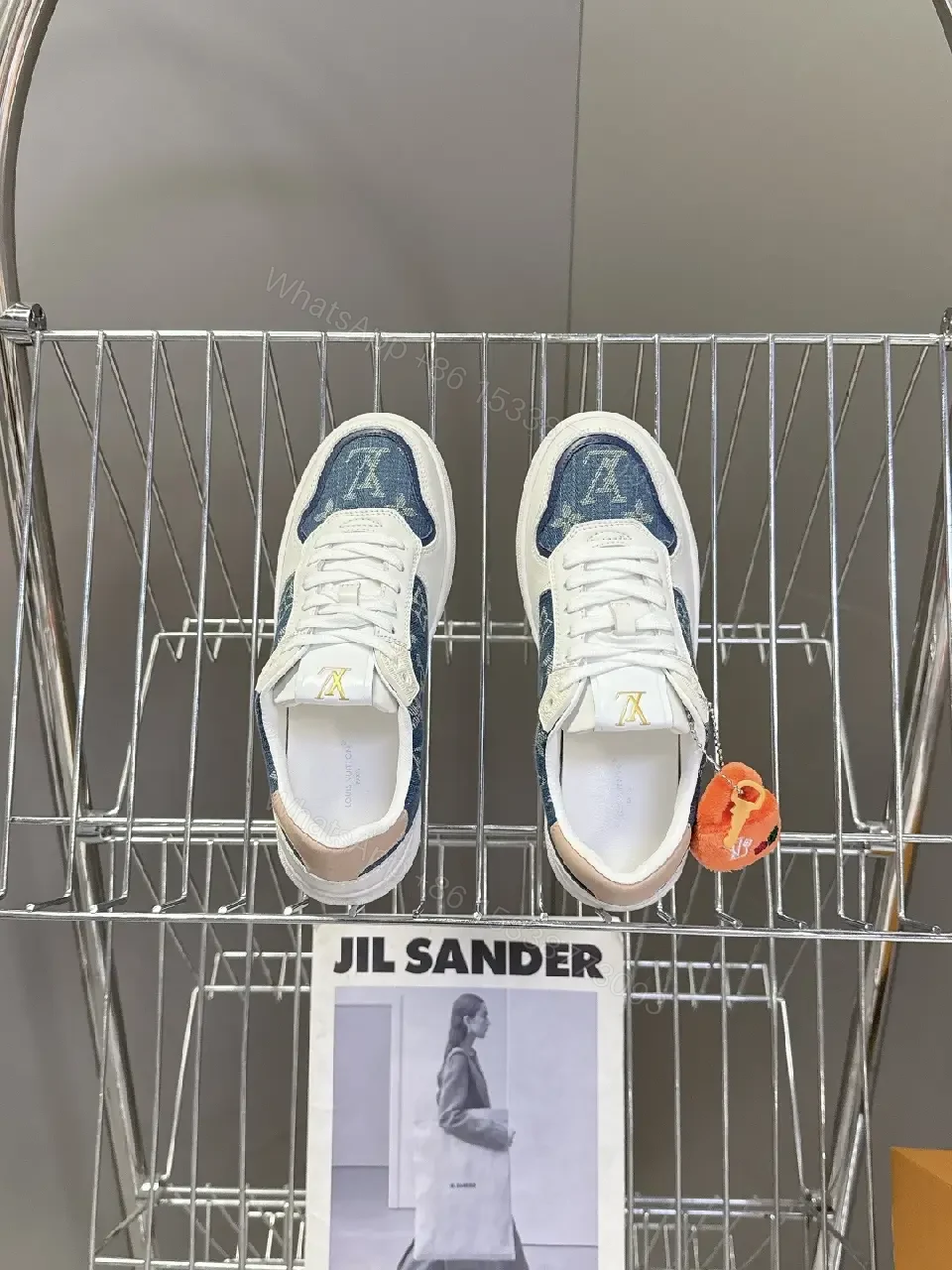 View 7 of Denim-Accent Luxury Sneakers with LV Flair