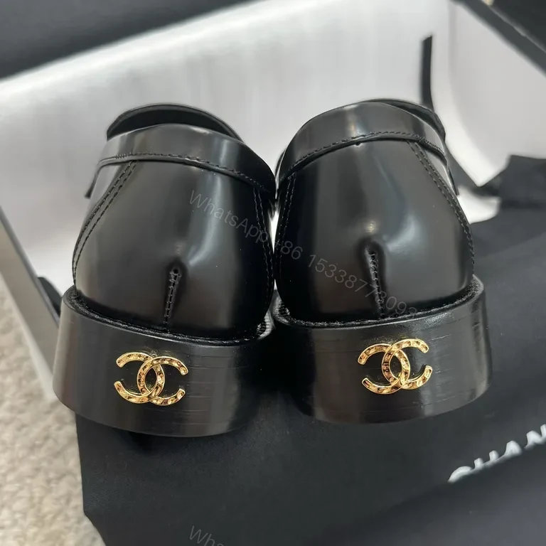 View 3 of Refined Black Leather Loafers with Gold Crest â€“ Luxe Comfort