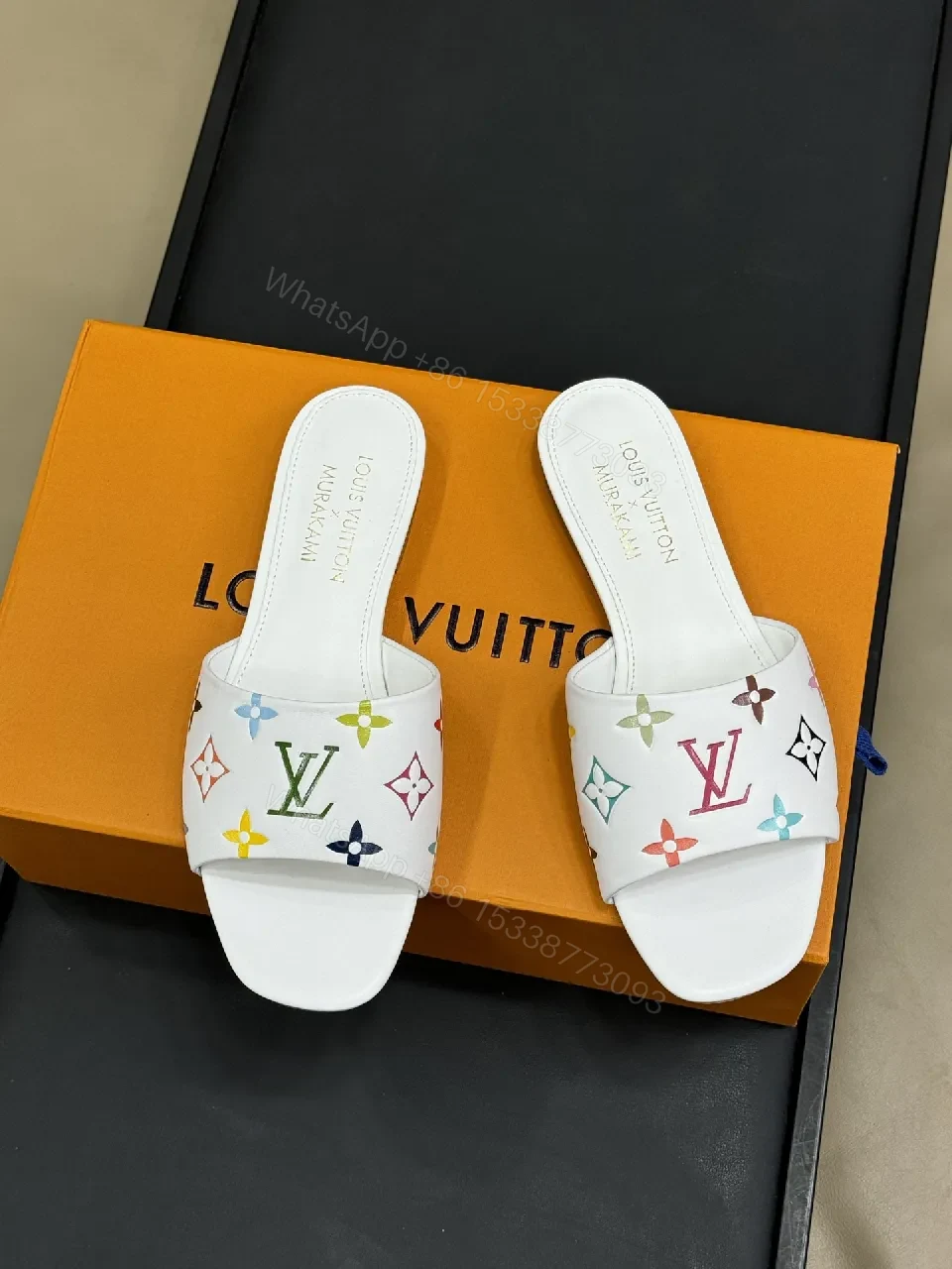 View 3 of White Leather Slides with Multicolor Monogram Detailing - Modern Luxury Comfort