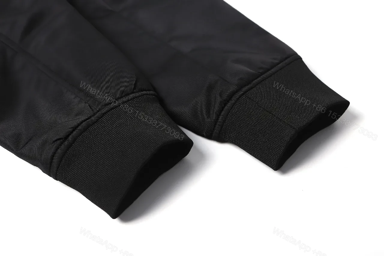 View 9 of Minimalist Black Bomber with Gold Accent: Modern Luxury Outerwear
