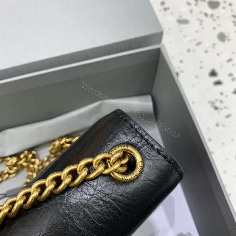 View 4 of Chic Black Leather Mini Bag with Gold B Clasp â€“ Compact Luxury