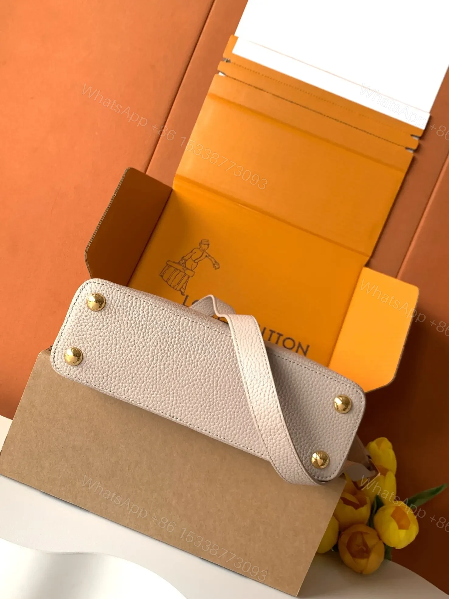 View 5 of Louis Vuitton Capucines handbag in a beige