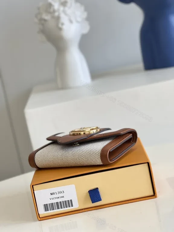 View 2 of Iconic Victorine Wallet: Compact Luxury Canvas & Leather Trim