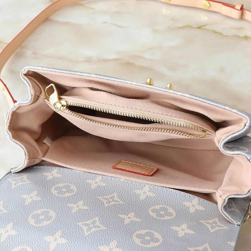 View 9 of Louis Vuitton Pochette Métis East West Coated Canvas Trianon 21Cm M12429