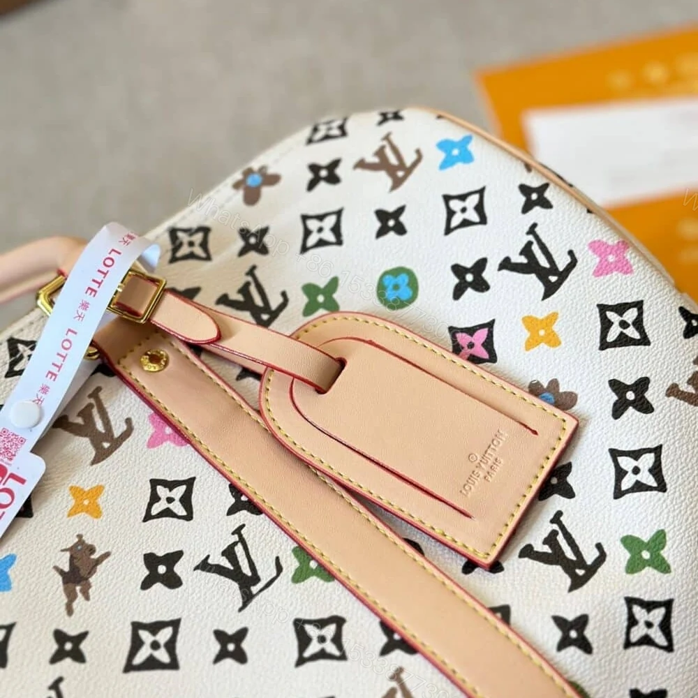 View 3 of Louis Vuitton Keepall Bandoulière Vanilla 40Cm M25233