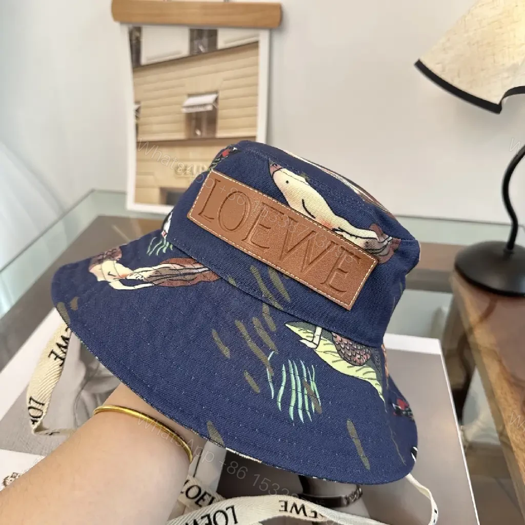 View 5 of Navy Floral Canvas Bucket Hat with Leather Brand Patch