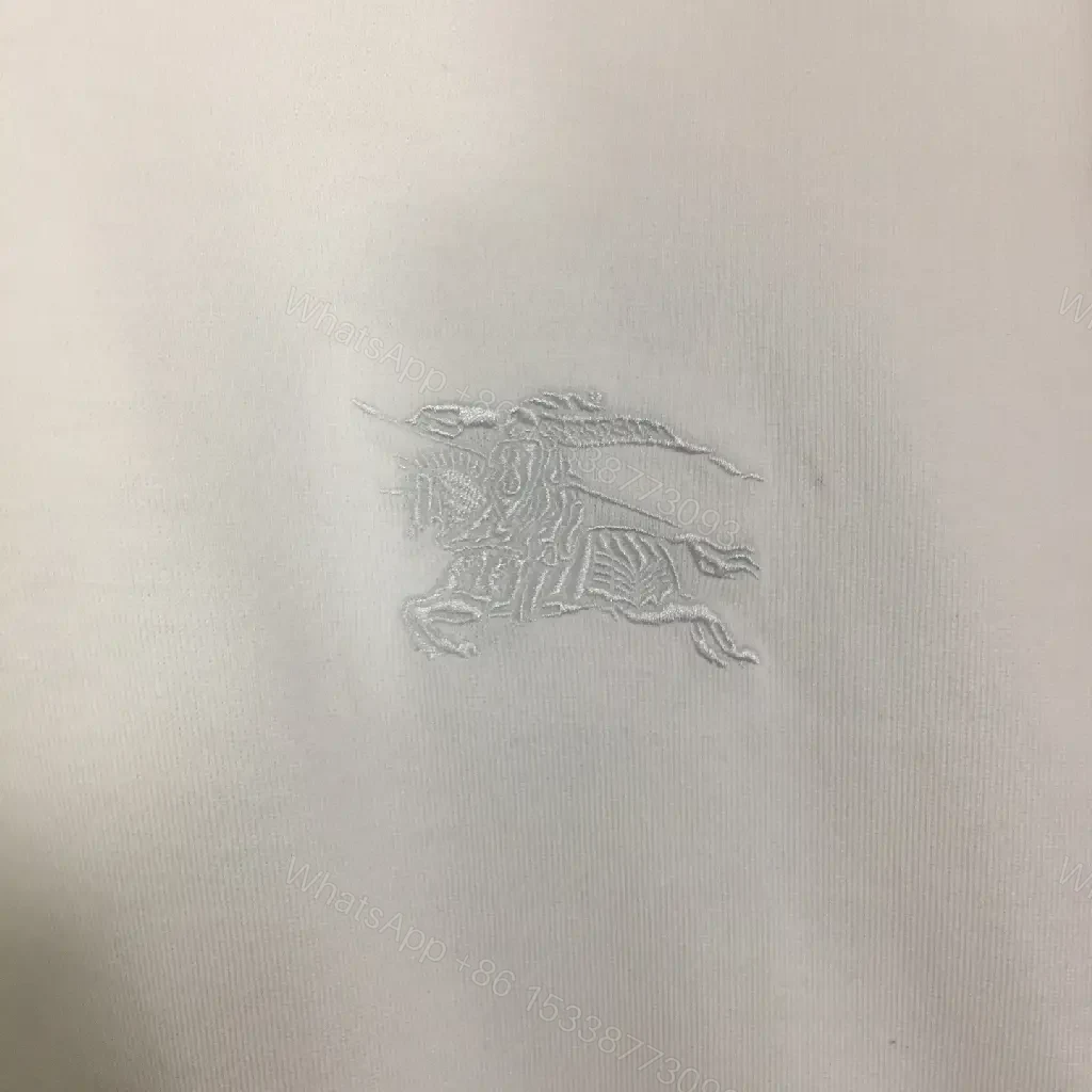 View 4 of White Tee with Burberry-Check Sleeves: Minimalist Luxury Top