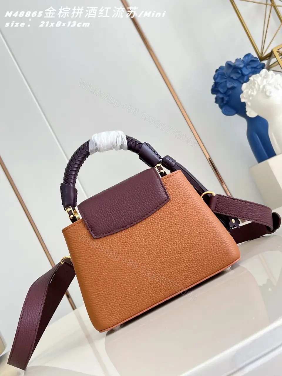 View 6 of Caramel Leather Mini Bag: Structured, Gold Emblem, Compact Luxury