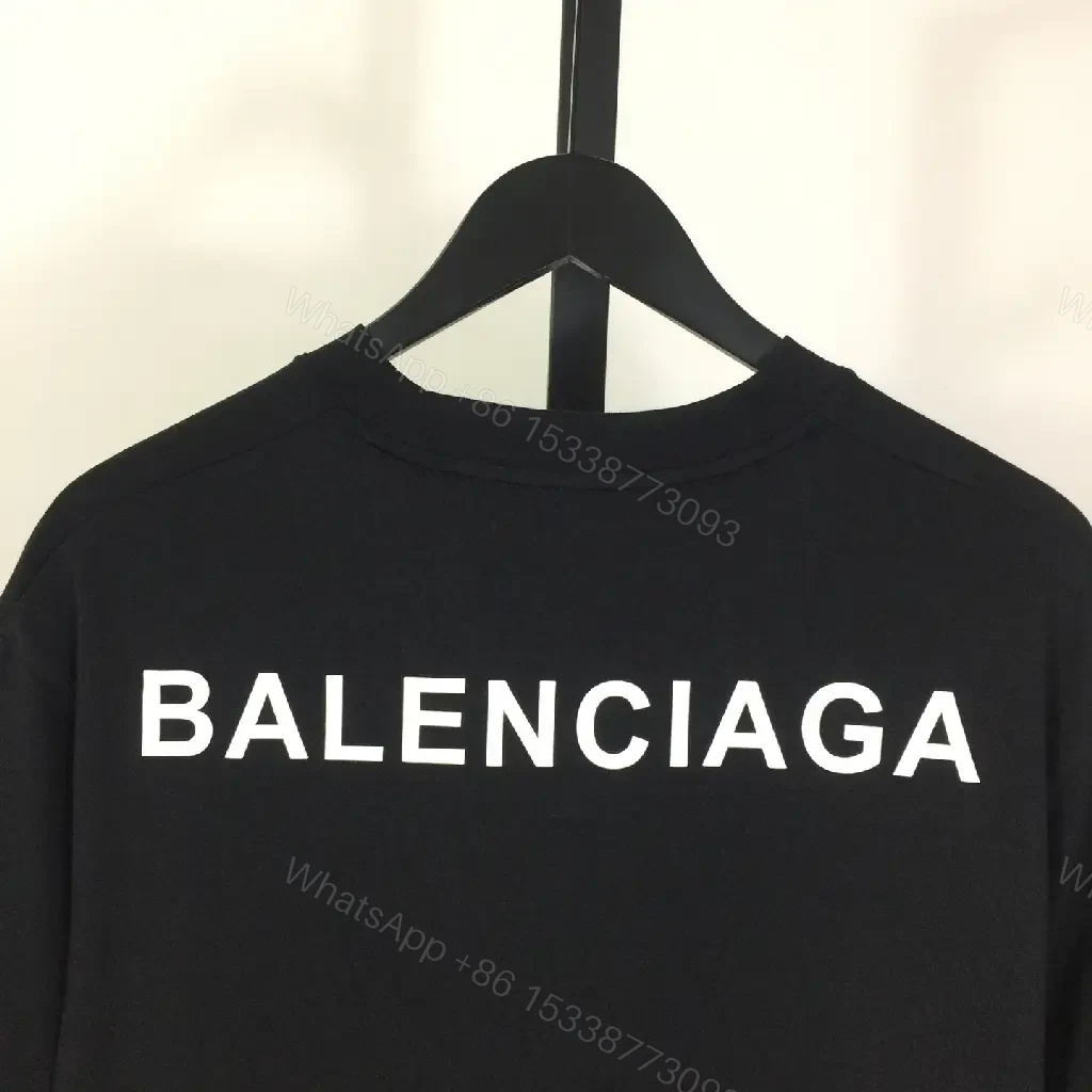 View 9 of Minimalist Black Mockneck Tee: Premium Cotton, Subtle Logo, Versatile Style