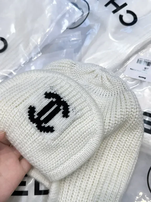 View 2 of Ivory Merino Knit Ear Warmer Hat - Luxe Logo Emblem