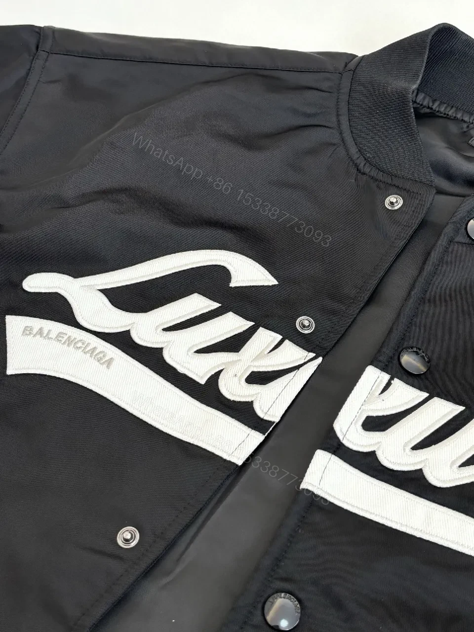 View 8 of Bold Black Logo Varsity Jacket | Luxe Streetwear Outerwear