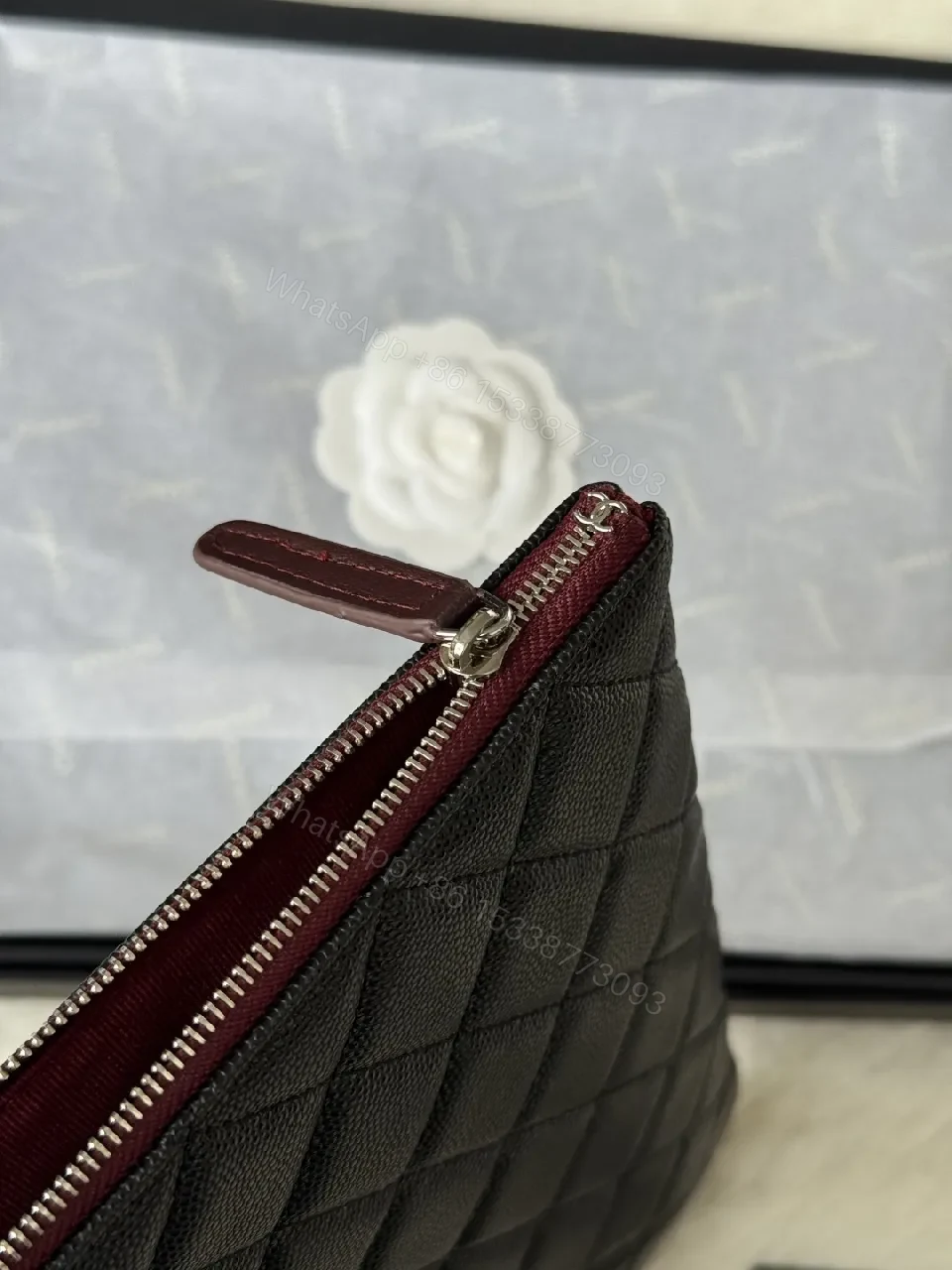 View 2 of Compact Black Quilted Leather Clutch with Silver Logo