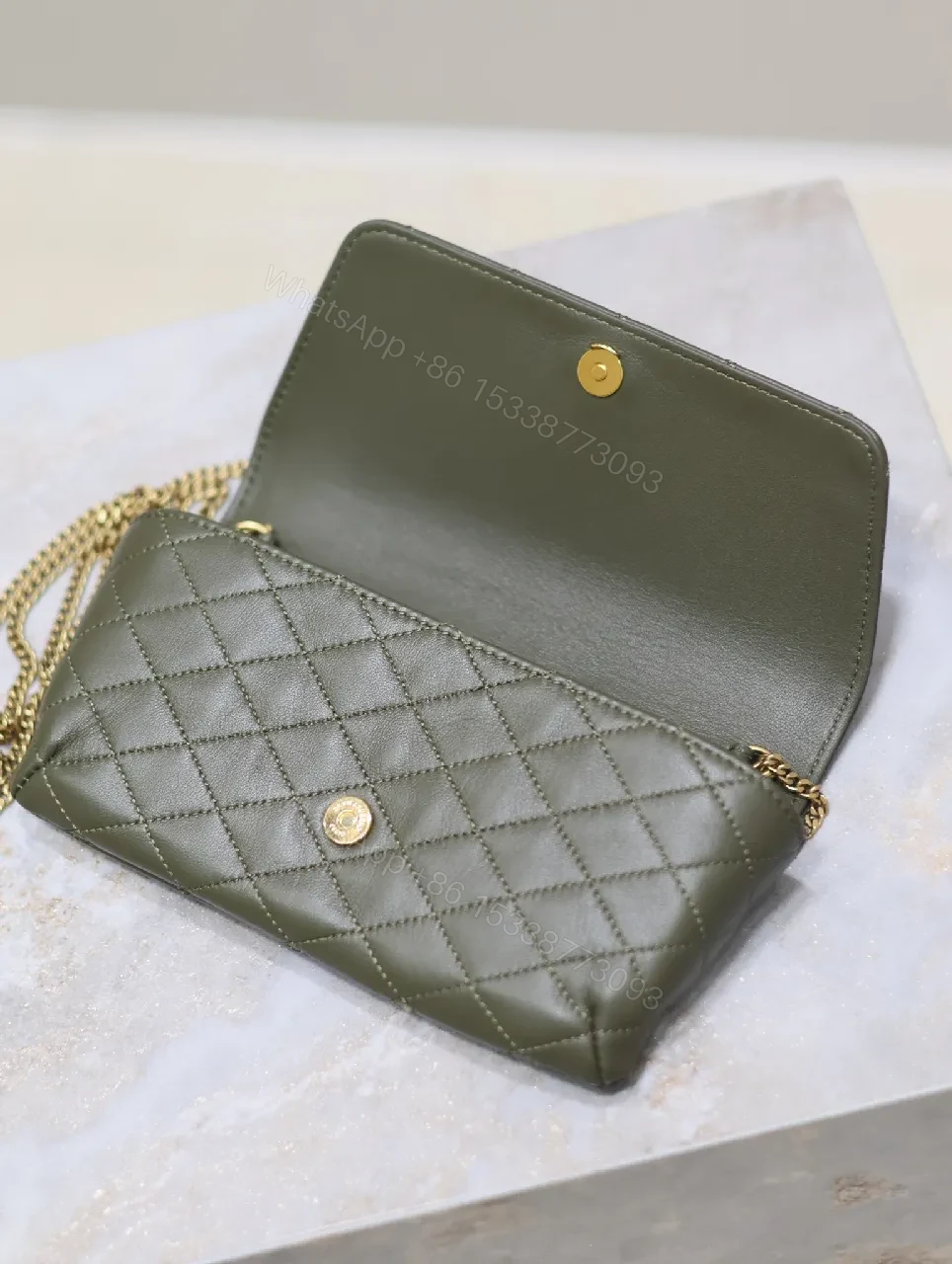 View 7 of Soft-Quilted Leather Clutch with Gold Emblem, Evening Style, Compact Luxury