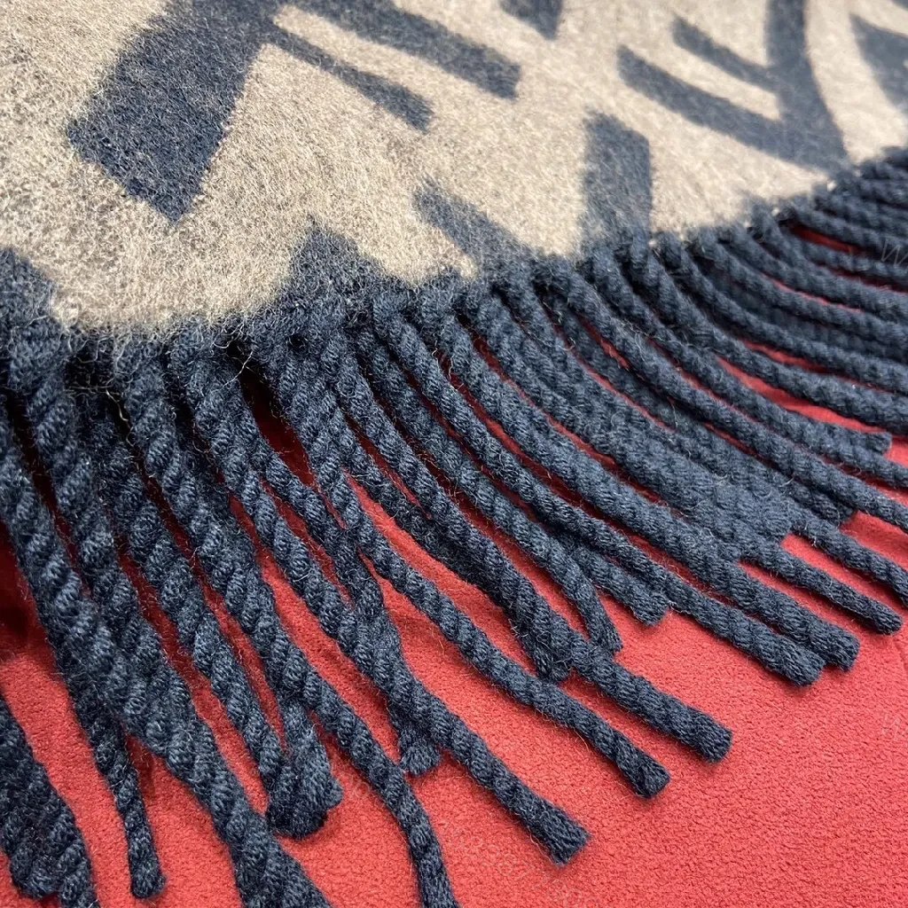 View 7 of Bold F-Inspired Monogram Wrap: Luxe Warmth & Fringe Detail