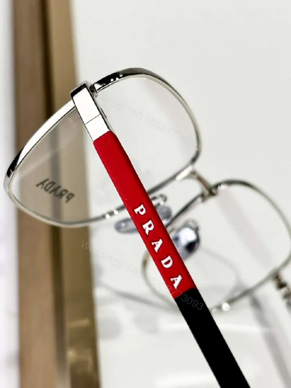 View 8 of Silver Metal Minimalist Precision Eyewear with Red Accents, Luxury Glasses